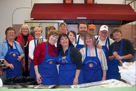 Members of the Foothill Lions Club, including Chef Arnie Romanello, prepare to serve to a sold-out crowd at the Nevada County Fairground Foundation’s first annual Cioppino Feed.